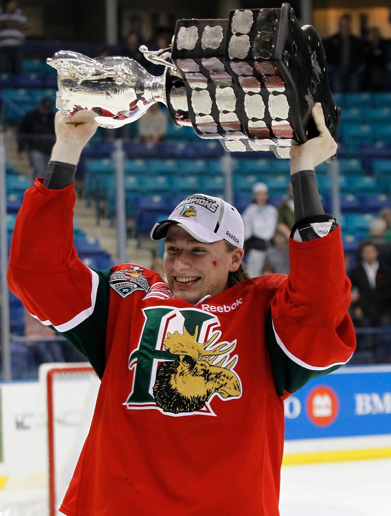 Austyn Hardie of the Halifax Mooseheads with the Memorial Cup after defeating the Portland Winterhawks , in the final of the 2013 Mastercard Memorial Cup at the Credit Union Centre on May 26, 2013 in Saskatoon, Saskatchewan. Al Charest/Calgary Sun/QMI Agency